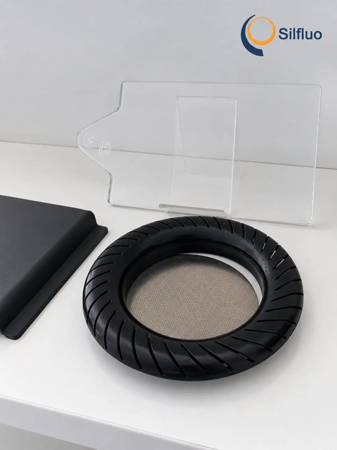 Slotted brake-disc ring coated in black polysilazane ceramic coating, with a honeycomb ceramic insert visible in the centre opening